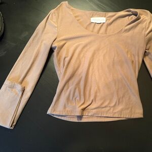 A tight tan sleeve shirt